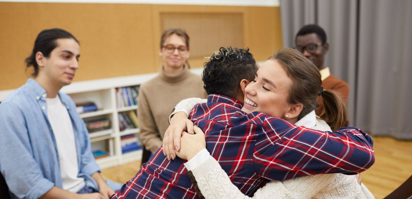 Group with individuals hugging