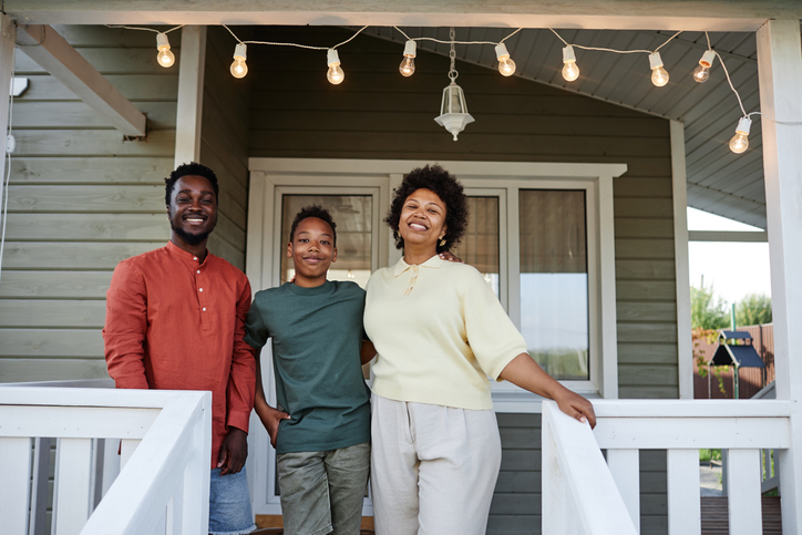 Family in front of home